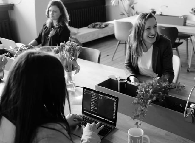 a group of people working in an office